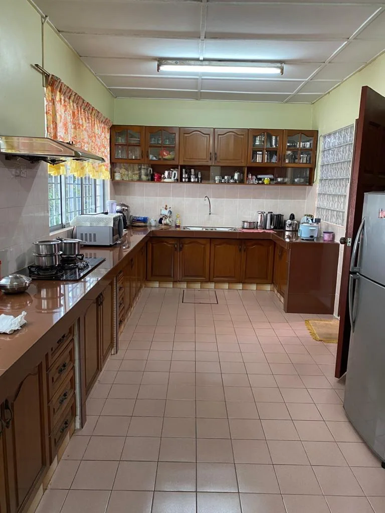 L-shaped kitchen of the Medan Batu Caves home