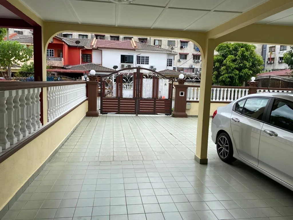 Covered car porch of the Medan Batu Caves home